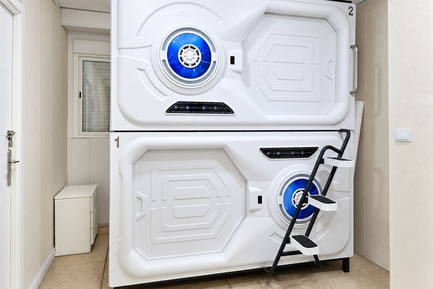 A white, two-door appliance with a control panel and a stepper.