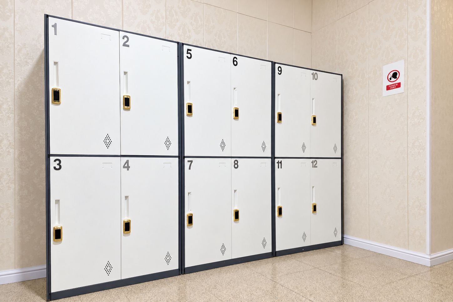 A row of numbered lockers in a hallway with a 'Please do not enter' sign on the wall.