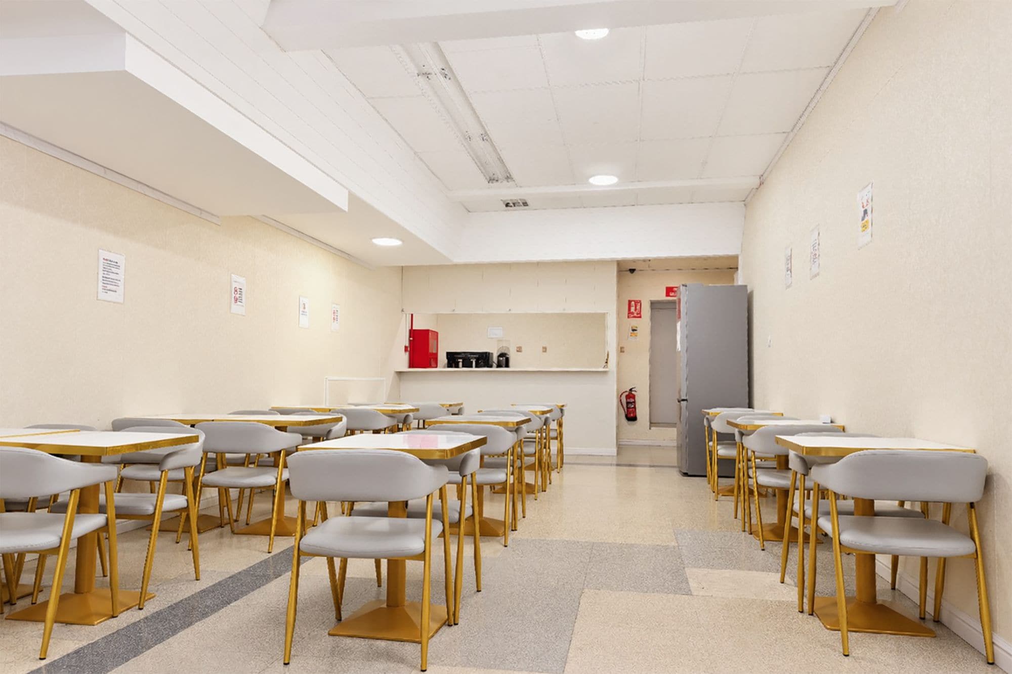 A conference room with tables and chairs arranged for a meeting.