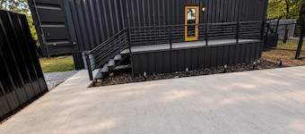 Container home 1 from LSU, with fire pit + patio, off street private parking