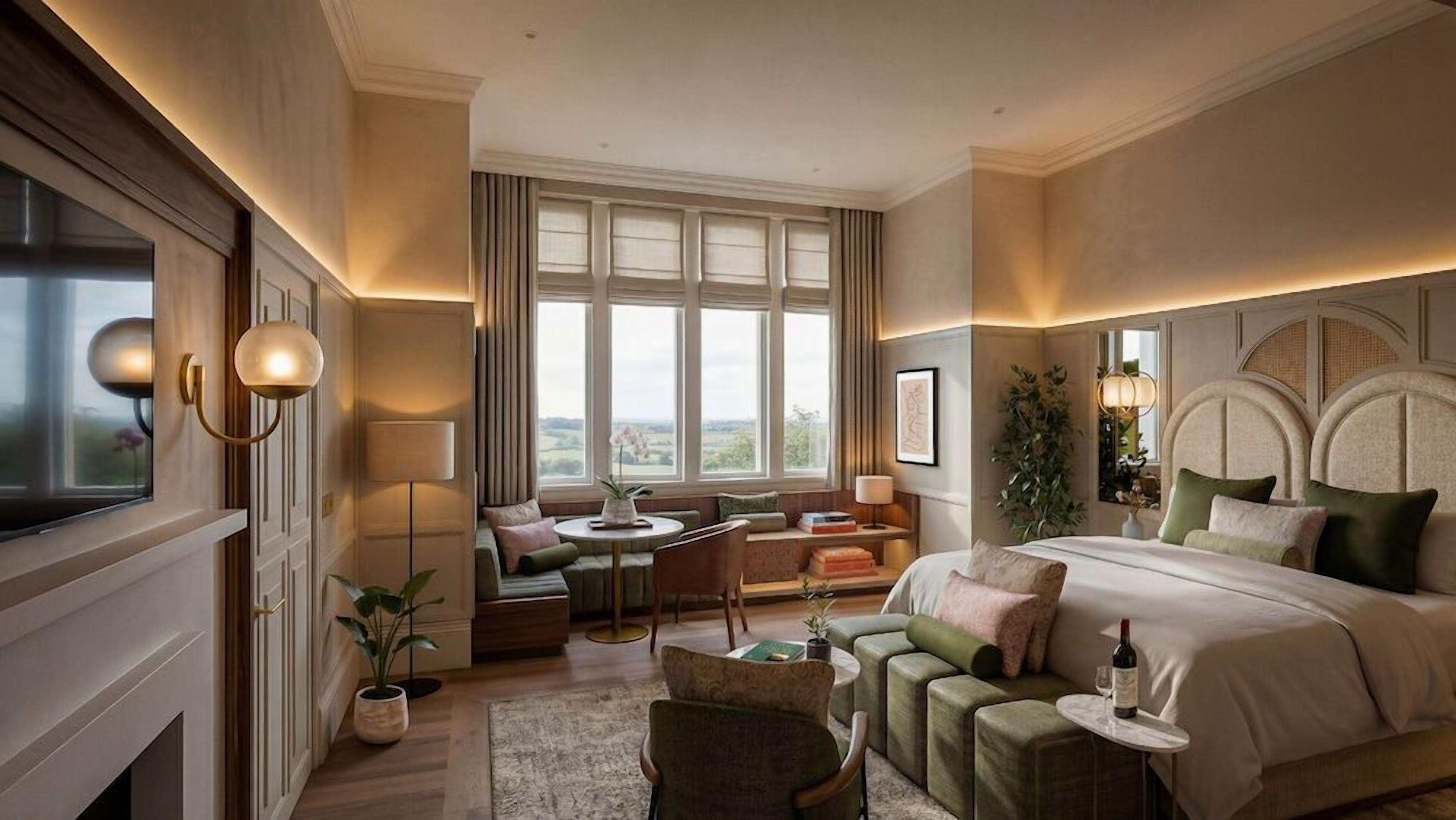 A hotel room with a large bed, a seating area with a table, and a view through the window.