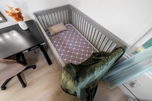 A corner room with a bed, a desk, and a chair. - Gated Yard, King Bed, Parking, Ranch-Style La Mesa (La Mesa)