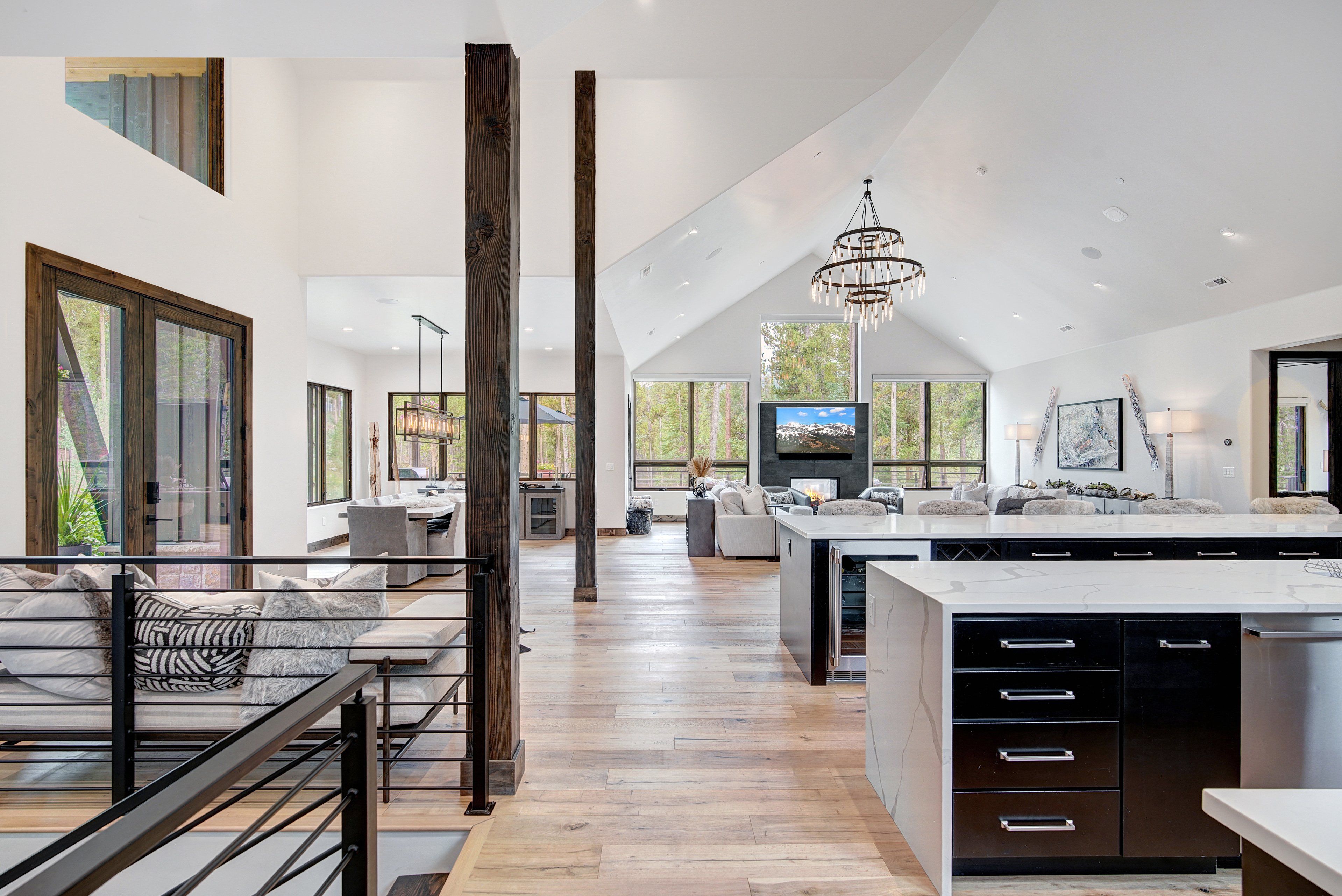 A spacious kitchen with a large island, modern appliances, and a view of the outdoors.