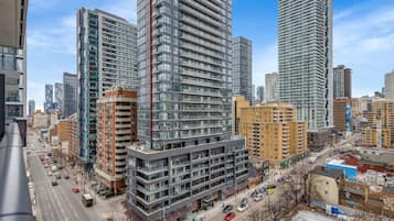 A high-rise building with multiple floors, large windows, and a modern architectural design.