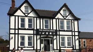 A two-story building with a sign reading 'The Ham & Cheese'. - Ham And Cheese Country Inn (Malton)