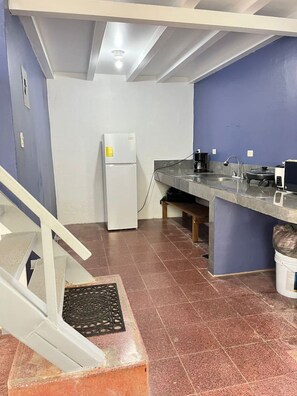 A kitchen with a refrigerator, sink, and a coffee maker. - Mountain Coffee Farm w/ Beautiful Valley Views (Piedades Sur)