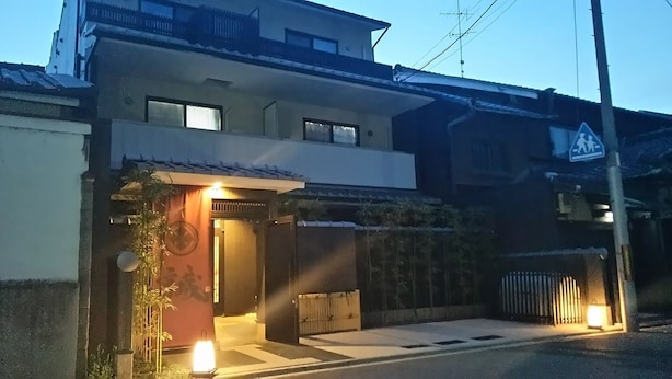 A residential building with a gated entrance, a visible door, and a small porch area. - Kyogura Tofukuji (Kyoto)