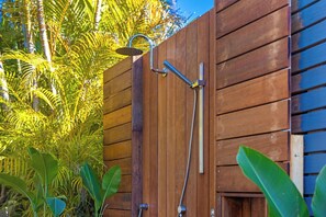 A wooden fence with a showerhead attached to it. - Green Oasis - Renovated family home (Port Macquarie)