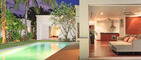 Una casa moderna con piscina, patio y sala de estar con sofá.