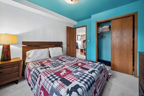 A bedroom with a bed, wooden nightstand, and a wardrobe. - Cozy 3-bedroom bed & breakfast in charming Jefferson with AC (Jefferson)