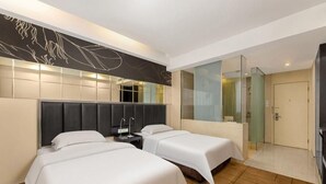 A hotel room with two beds, a large mirror, a glass shower enclosure, and a modern design. - Metropolo Jinjiang Hotels (Hefei)