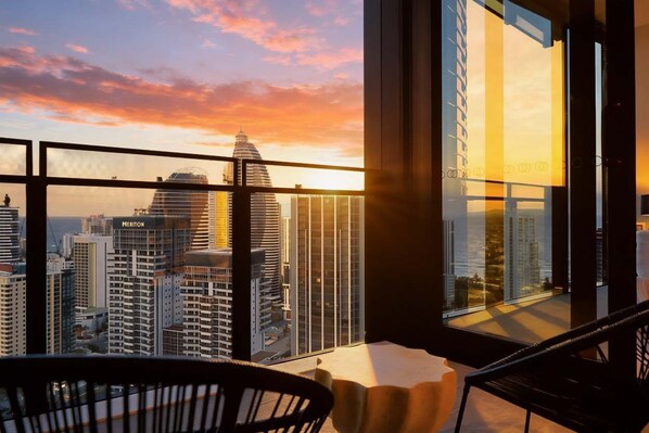 A high-rise hotel room with a panoramic city view, large windows, and modern furnishings. - CASSA CASINO TOWER 2 - Brand New Premium Residence Managed by The Cassa (Broadbeach)