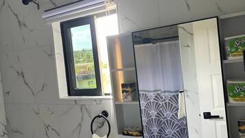 Shower, hair dryer, bidet, towels