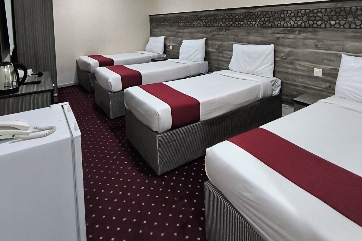 Basic Quadruple Room | Blackout drapes, iron/ironing board (on request), WiFi (free)