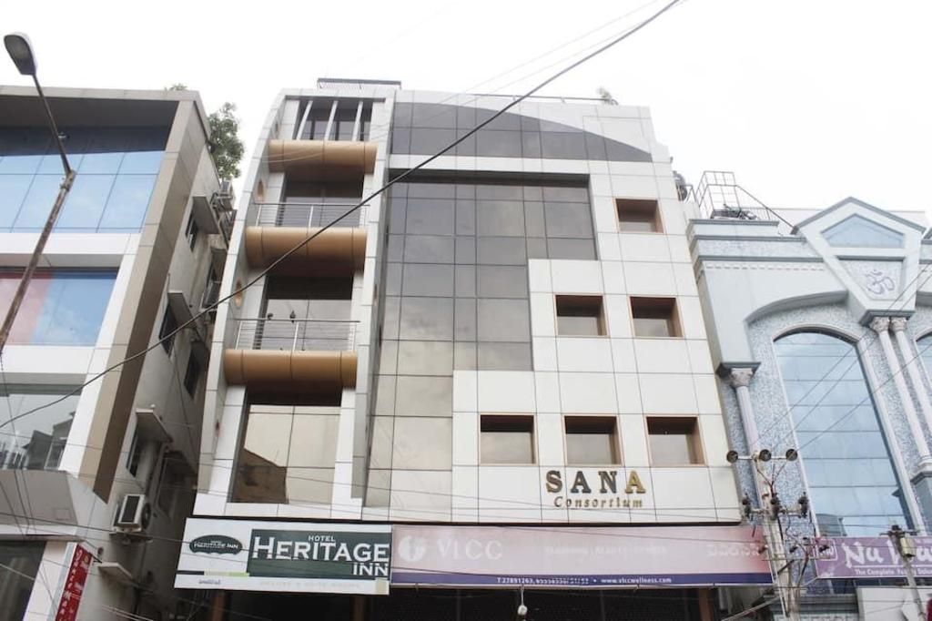 A multi-story building with a sign for 'SANA' on the facade.
