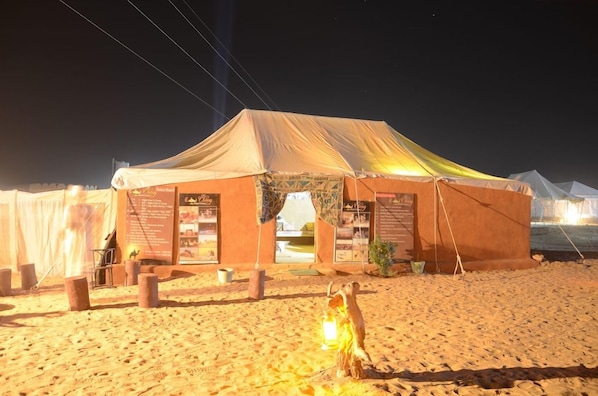 A desert tent with a canopy, a signboard, and a lantern. - The Chirag Desert Camp (Jaisalmer)