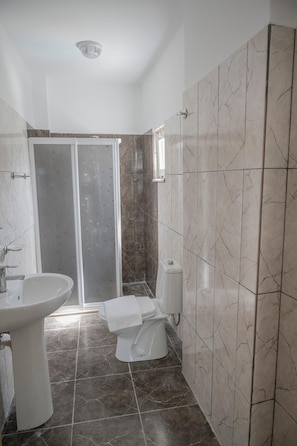 A bathroom with a shower, toilet, and sink. - Badoka Boutique Hotel (Marmaris)