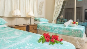 A hotel room with two beds, a nightstand, a lamp, and a window with curtains. - Muri Lagoon Villa (Rarotonga)