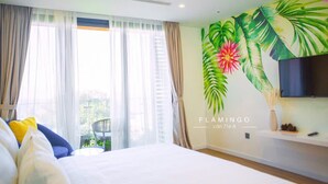 Quarto casal ou duplo luxo, vista parcial para o oceano