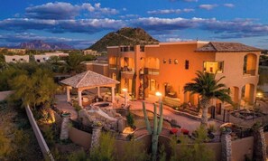 A multi-story building with a courtyard, outdoor seating, and a pool area. - Mountain View Estate w/ Heated Pool, Spa & Slide (Mesa)
