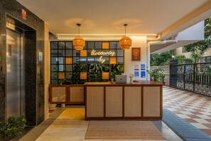 A reception desk with a sign that reads 'giveaway by PACK'. - LiveAway Pune (Viman Nagar) by PACK (Pune)