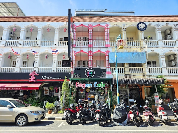 A building with a massage spa and vegan cafe on the ground floor.