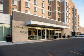 A Marriott Fairfield hotel with a modern facade, large glass entrance, and a parking area. - Residence Inn Winnipeg (Winnipeg)