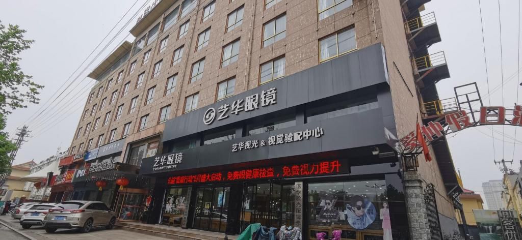 A multi-story building with a storefront on the ground floor.