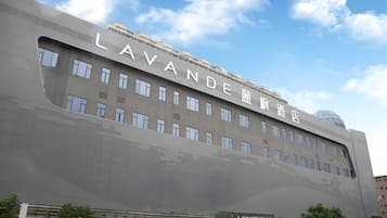 A hotel with a prominent sign reading 'LAVANDE' and a modern architectural design.