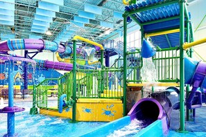 A water park play structure with slides and splash pads. - Hampton Inn Oswego (Oswego)