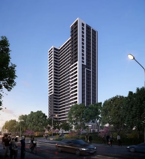 A high-rise building with a modern architectural design, featuring a prominent vertical structure and a series of balconies. - Cozy 1-bedroom apartment in charming Nairobi with a city view (Nairobi)