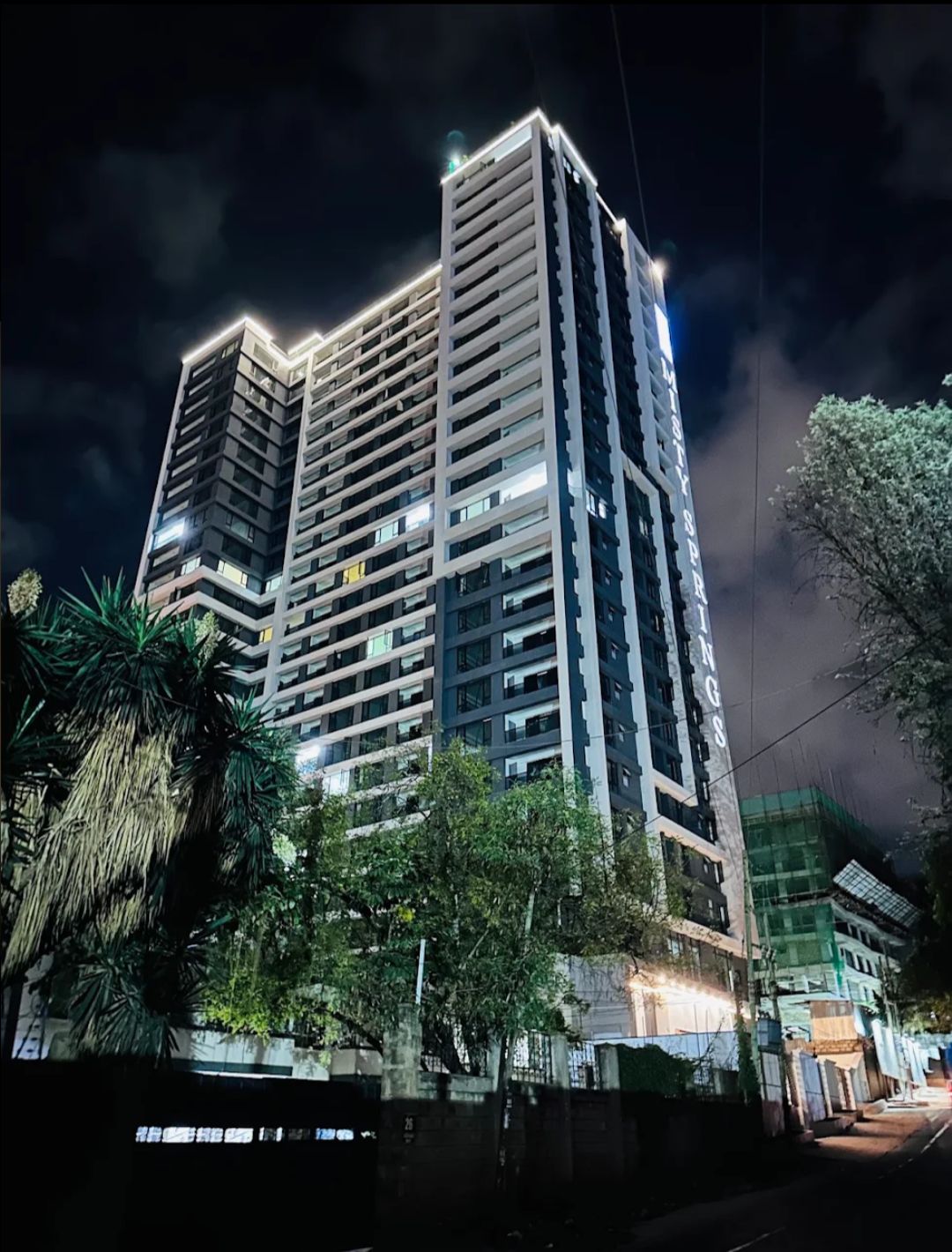 A high-rise building with multiple floors, large windows, and a modern architectural design.