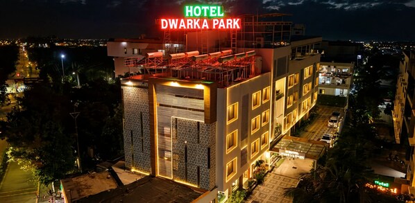 A multi-story hotel with a prominent sign reading 'HOTEL DWARKA PARK' at the top. - Hotel Dwarka Park (Rahata)