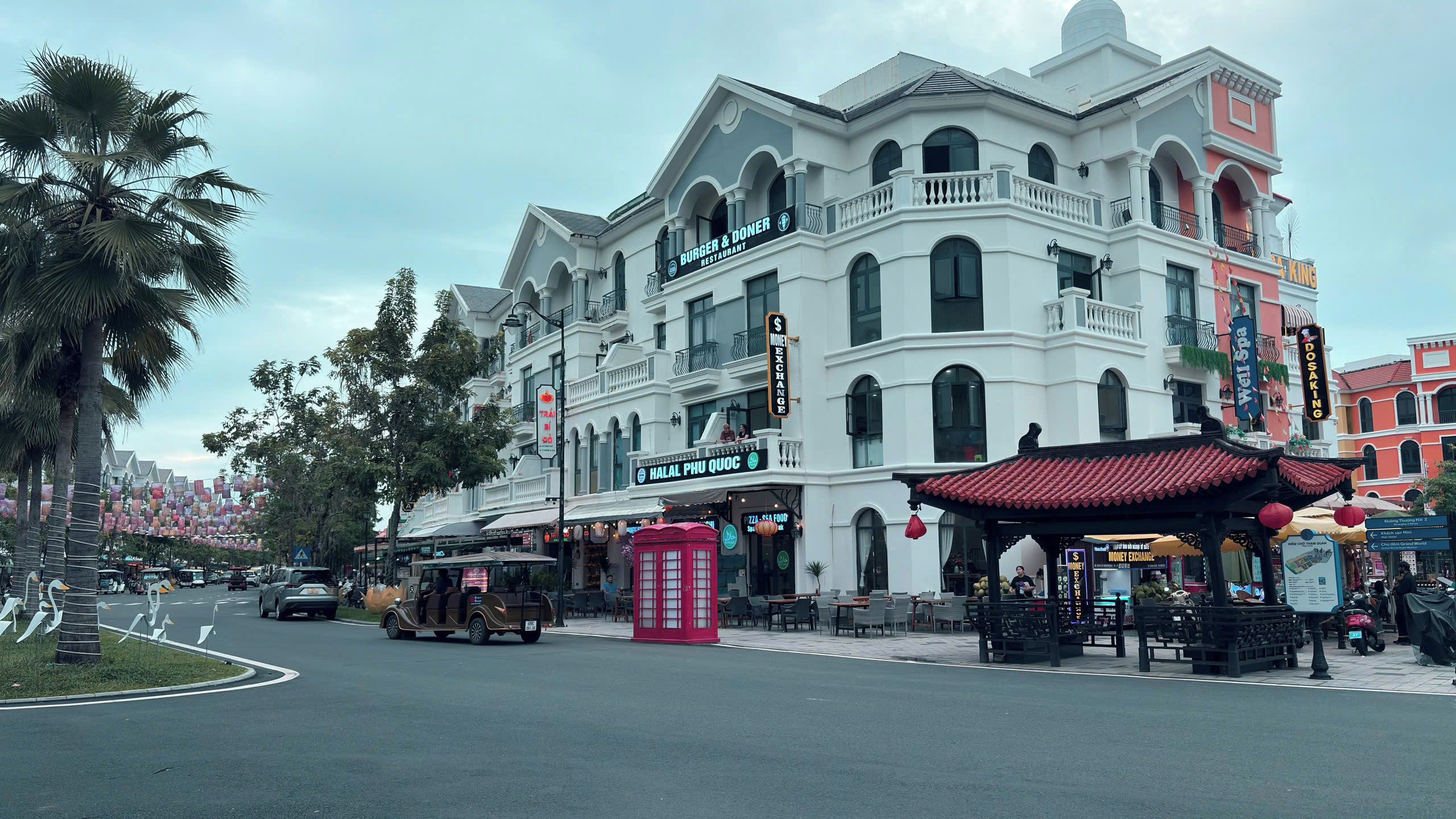 A building with a restaurant named 'Burger & Doner' and a money exchange service.