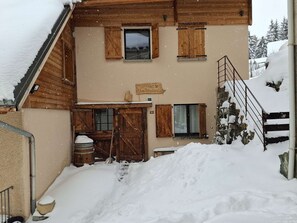 A wooden building with a snow-covered roof, wooden shutters, and a sign that reads 'Les Teufels.' - Spacious chalet for 8 guests - 3 bedrooms (Valloire)
