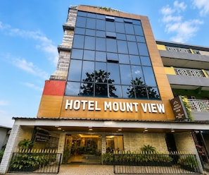 A hotel with a modern facade, large windows, and a sign reading 'HOTEL MOUNT VIEW'. - Deluxe Hotel Mount View (Siliguri)
