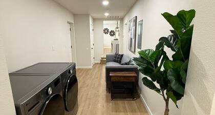 Modern 3-Bedroom Home with Garage, Smart TVs, and Laundry Facilities.