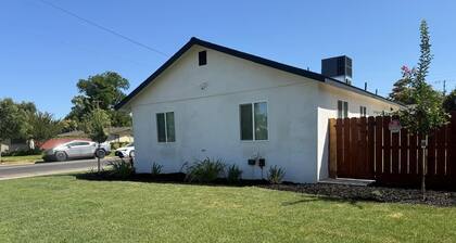 Modern 3-Bedroom Home with Garage, Smart TVs, and Laundry Facilities.