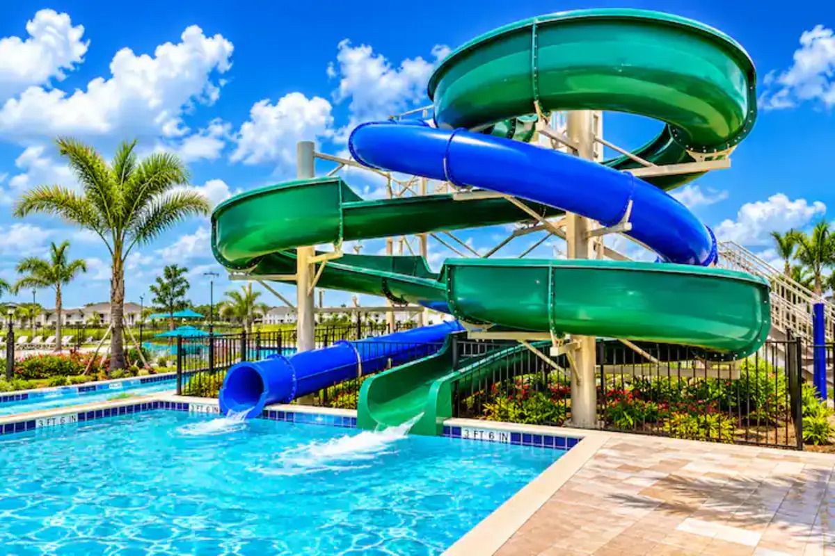 A water park with multiple slides and a pool.