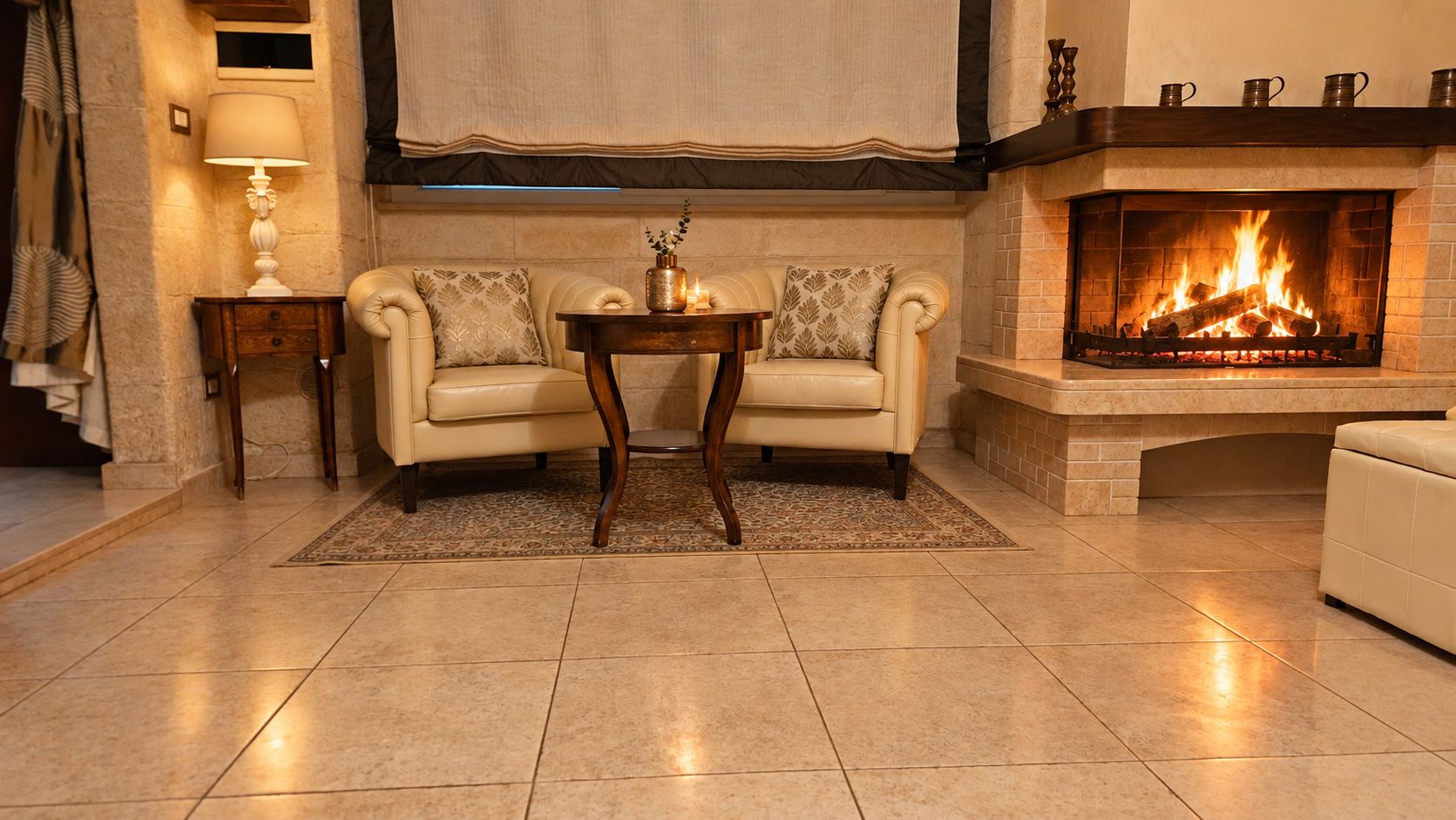 A living room with a fireplace, two sofas, a coffee table, and a rug.