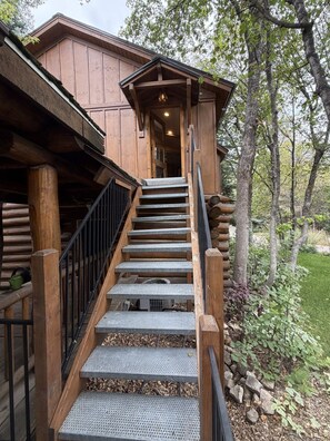 A wooden staircase leading to a cabin with a covered porch. - Among the Pines • Minutes to Sundance (Sundance)