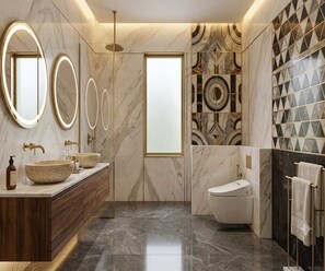 A modern bathroom with a marble vanity, dual sinks, and a freestanding toilet. - Premium Deluxe Room RIO Patna (Patna)