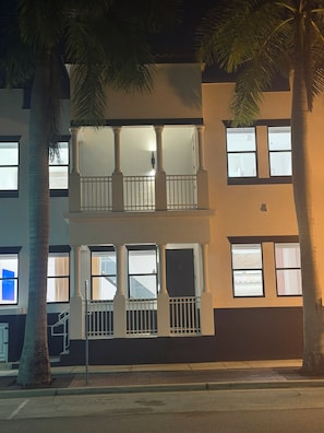 A multi-story building with balconies and large windows. - Designer River District Townhouse (Fort Myers)