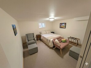 A bedroom with a bed, a chair, a desk, and a small table. - Spacious 4 bedrooms 2 bath rental near bus line Sundance Film Festival 2027 (Boulder)