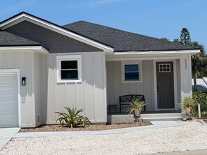 A single-story house with a front porch, a garage, and a small garden area. - Close to Beaches ~ Downtown Venice ~ Bike Trail ~ Park (Nokomis)