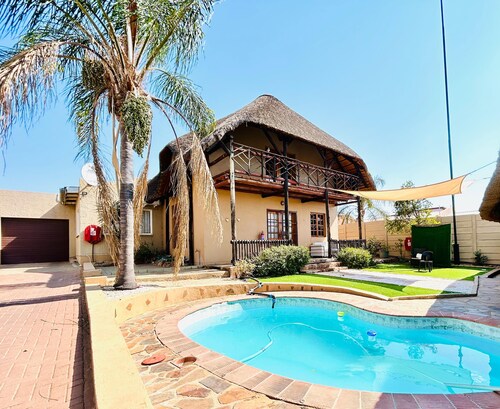 Entire home with thatched loft office & pool