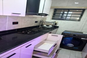 Deluxe Double Room, Balcony, City View | Private kitchen | Mini-fridge - Dual Hotel and Apartments Limited (Oshodi)