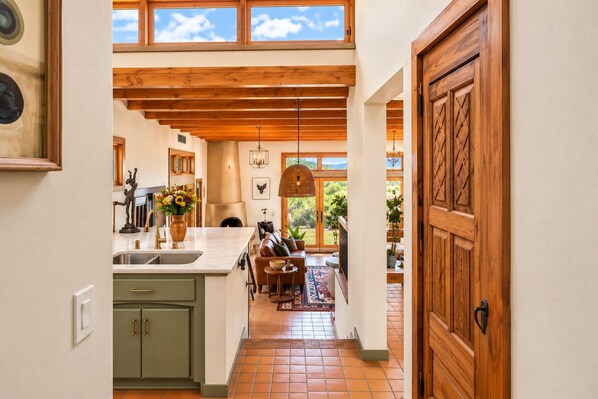 Elevated view from the kitchen area. Open concept, skylights, ample light.