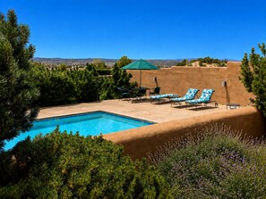 A pool area with a clear view of the surrounding landscape, including trees and distant hills. - Quiet Luxury Retreat, Mtn Views, Walk to Four Seasons, 3 Patios, Hiking galore! (Santa Fe)