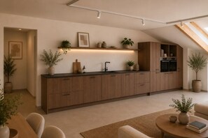 A modern kitchen with wooden cabinets, a built-in oven, and a countertop with plants.